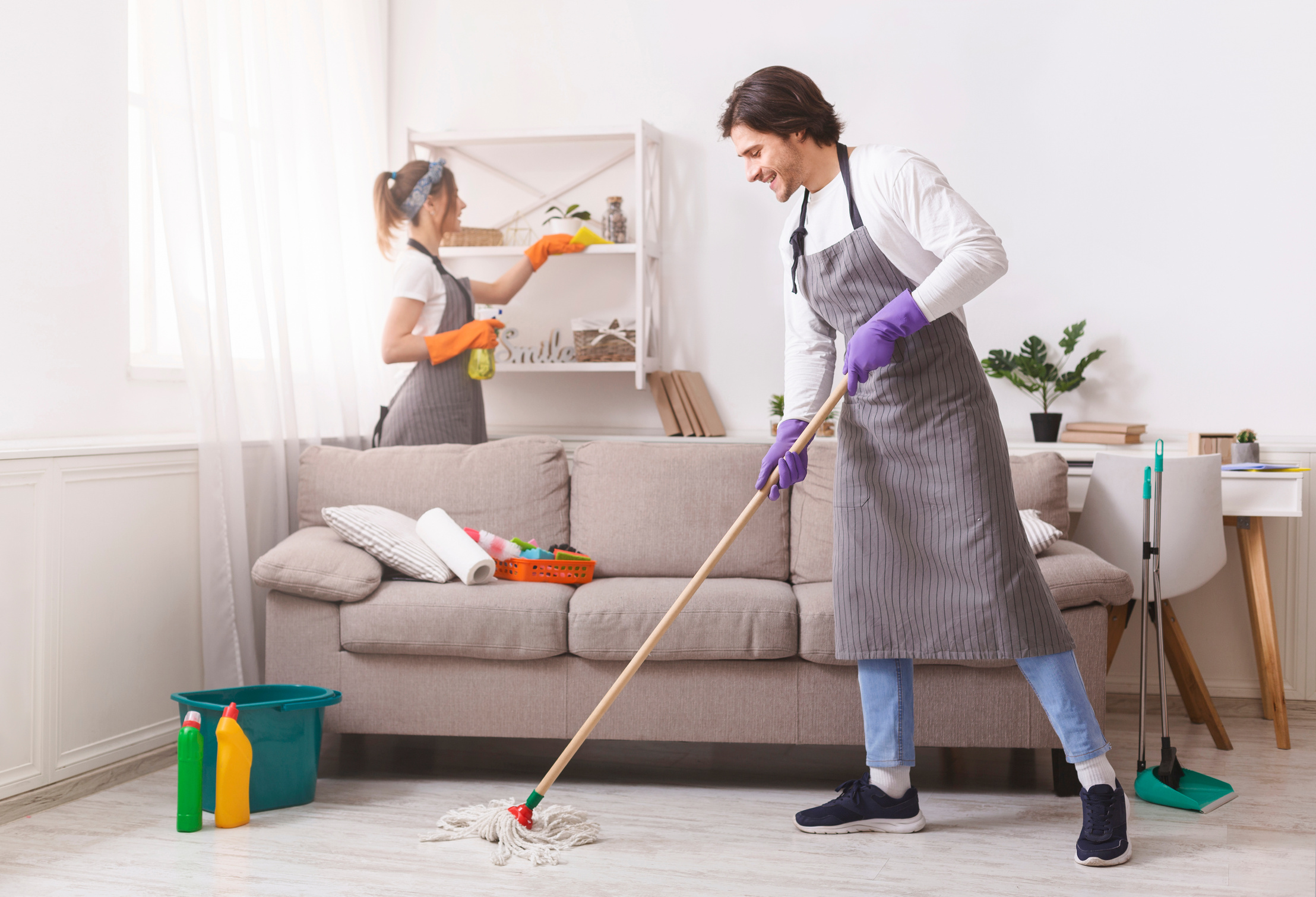 Residential Cleaning Services. Couple Of Skilled Housekeepers Tidying Up Apartment
